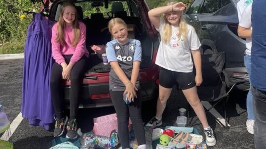 Children enjoying the Kid's Car Boot Sale in 2023 at Haywood Lodge